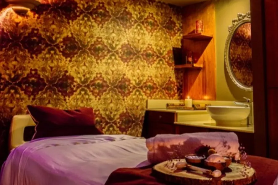 A candlelit treatment room at Revas Spa