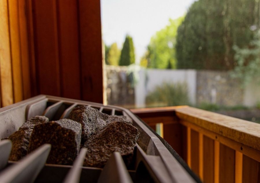 Sauna stones by the window in the herb sauna